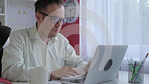 Business man working at home office on laptop