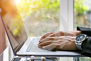 Business man working on laptop, Close up of hands of business man, Business concept