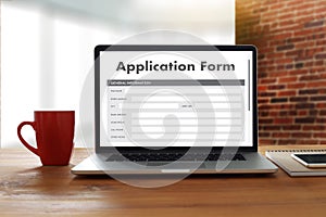 business man working on laptop computer use Online Web Job Application Form moniter photo