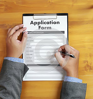 business man working on laptop computer use Online Web Job Application Form moniter photo