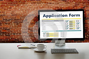 business man working on laptop computer use Online Web Job Application Form moniter photo