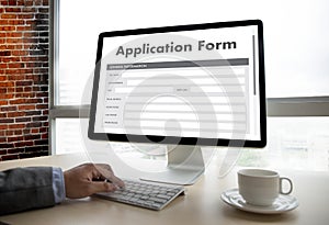 business man working on laptop computer use Online Web Job Application Form moniter photo