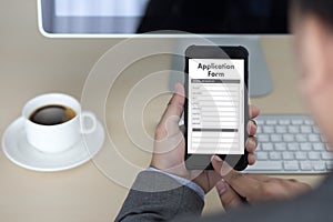 business man working on laptop computer use Online Web Job Application Form moniter photo