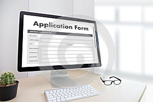 business man working on laptop computer use Online Web Job Application Form moniter photo