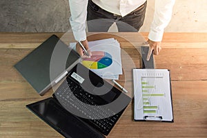 Business man working with laptop and documents