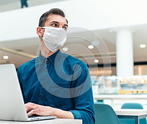 Business man working on a laptop in an empty office