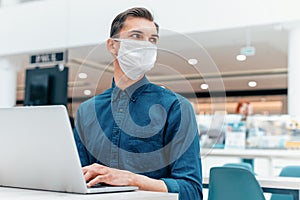 business man working on a laptop in an empty office