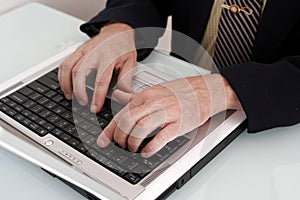 Business man working on a notebook computer