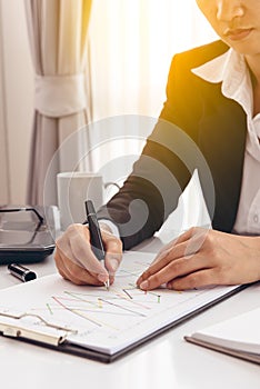 Business man working at office and documents on she desk