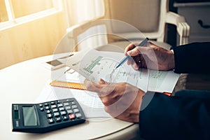 Business man working at office with documents on his desk