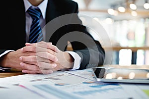 Business man working at office with laptop and documents on his