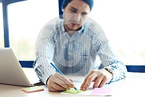 Business man working at office with laptop and documents on his desk