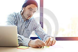 Business man working at office with laptop and documents on his desk