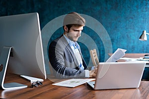 Business man working at office with laptop and documents on his desk, consultant lawyer concept.