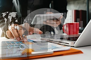 Business man working at office with laptop and documents on his desk, financial adviser analyzing data