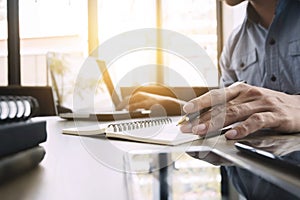 Business man working at office with laptop and documents on his desk freelancer concept