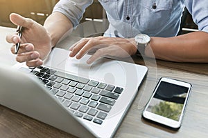 Business man working at office with laptop and documents on his desk freelancer concept