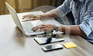 Business man working at office with laptop and documents on his desk freelancer concept