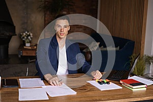 Business man working in office with laptop and documents on his desk, lawyer