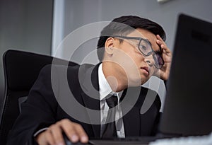 Business man working problem using laptop