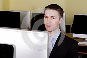 Business man at workplaces in computer