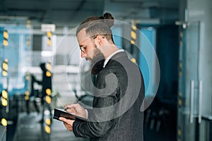 Business man writing notebook memos data analysis