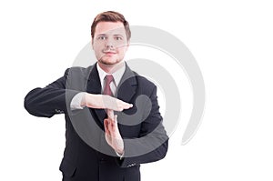 Business manager or businessman showing timeout gesture photo