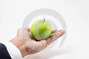 Business market share concept.Green apple on businessman hand