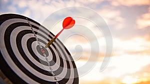 Business marketing as concept. Red dart arrow hitting in the target center of dartboard Target hit in the center