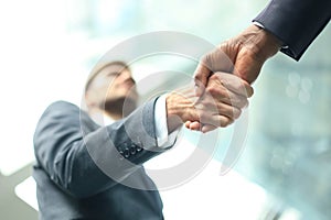 Business meeting. African American businessman shaking hands with caucasian businessman.