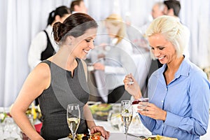 Business meeting buffet smiling woman eat dessert