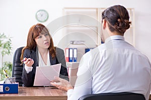 Business meeting between businessman and businesswoman