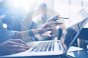 Business meeting concept.Closeup view of coworkers team working with mobile computer at modern office.Analyze business