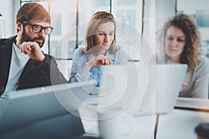 Business meeting concept.Coworkers team working with mobile computer at modern office.Blurred background.Horizontal.