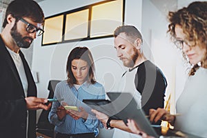 Business meeting concept.Coworkers team working with mobile devices at modern office.Blurred background.Horizontal.