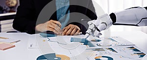 Business Meeting With Human and Robot Collaborating on Data Analysis with Charts and Graphs in Modern Office Environment