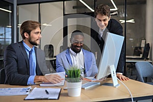 Business meeting - manager discussing work with his colleagues.