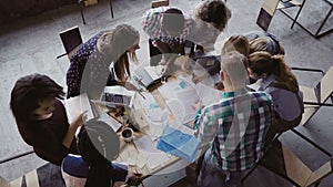 Business meeting at modern office. Top view of multiracial group of people working near the table together.