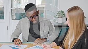 Business meeting in office of african businessman and caucasian startup owner