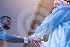 Business meeting with Sheik. Business muslim partner shaking hand in the meeting