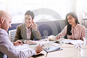 Business meeting between three professional partners early in the morning