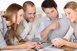 Business meeting of young people around the table