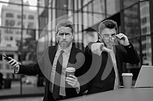 Business men aggressive outdoor. Conflict and business concept. Colleagues aggressive disputing having disagreement