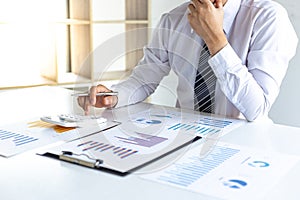Business men are calculating real estate investment expenditures and analyzing the company`s finances in line with the global eco