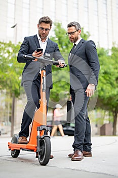 Business men had teamwork skills. Business men were great communicators with their team. Business man riding an electric