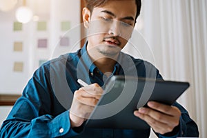 Business men hand using  tablet payments online shopping, omni channel, digital tablet docking keyboard computer at office in sun