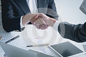 Business men handshake for greeting, agreement, successful deal, partnership, cooperation at office desk. Business shaking hand