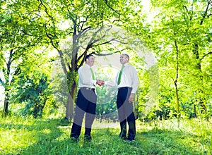 Business men handshaking in Garden