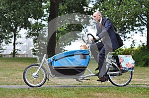 Business men hurrying to the childÃ¯Â¿Â½s creche photo