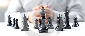 Business men make plans to play chess with Prudence and success